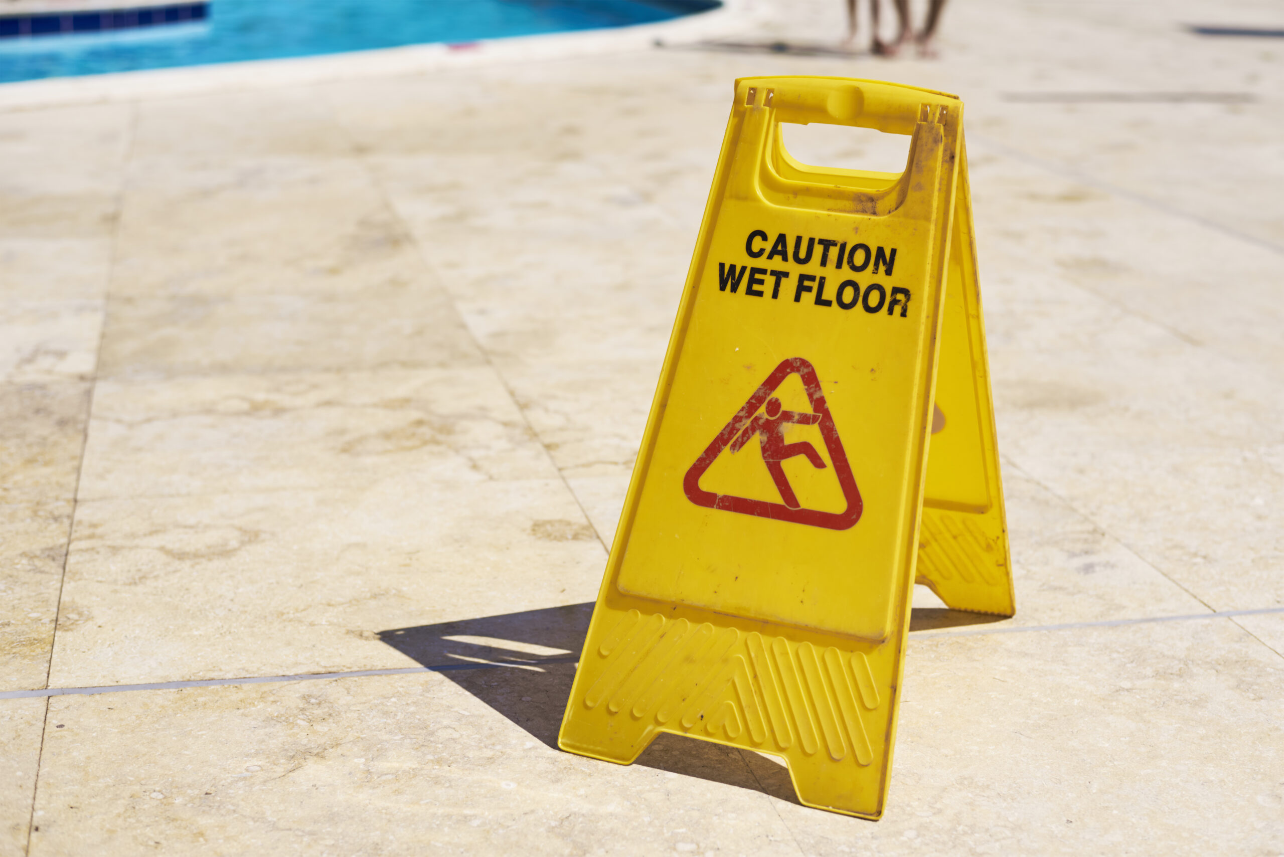 yellow wet floor caution sign